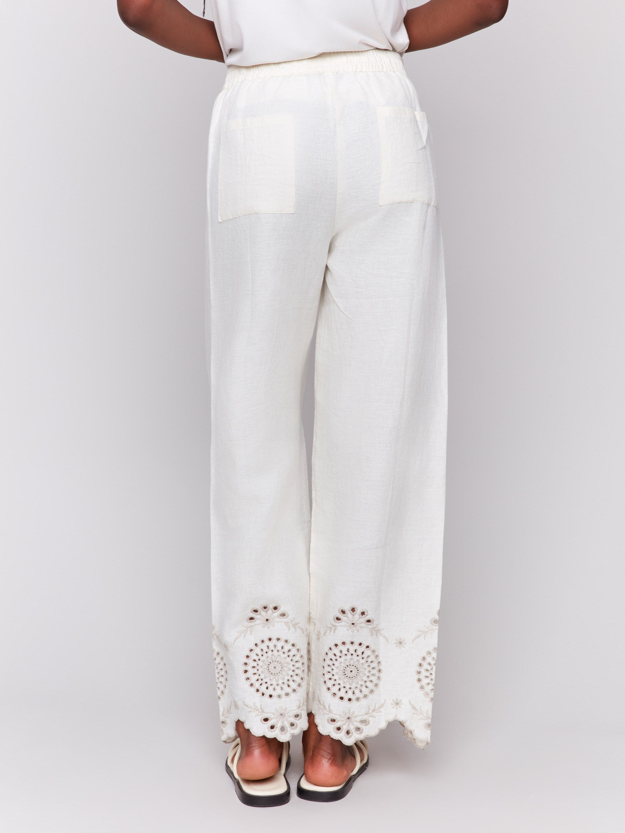 Linen pants showcasing drawstrings on waistband by Charlie B.
