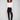 Black pants featuring a skinny fit and styled with a white top, highlighting the elastic waistband by Charlie B.