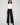 Black pants with a flattering wide-leg silhouette, offering both comfort and style for versatile wear, by Charlie B.