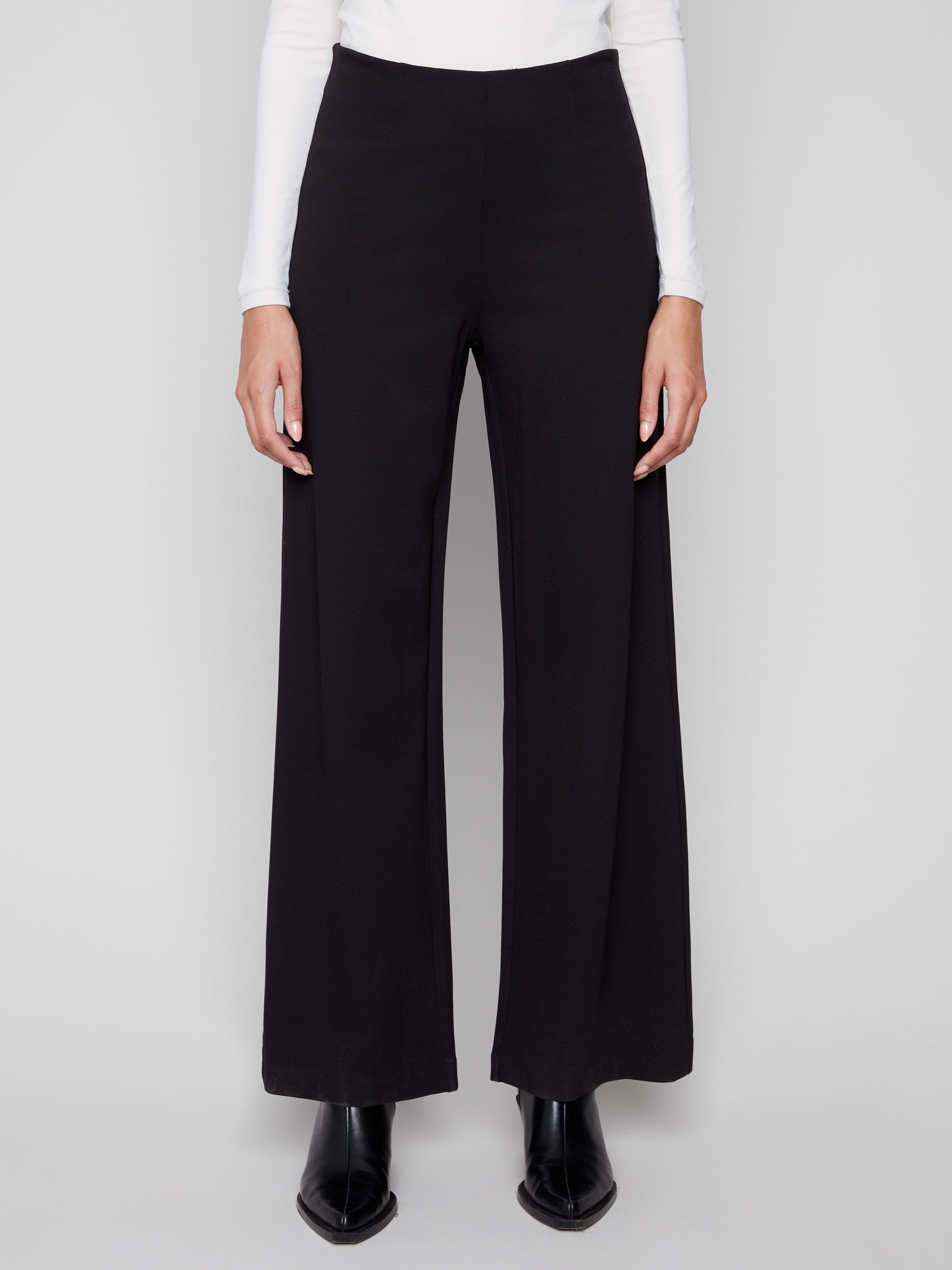 These long black pants feature an elegant design with a smooth finish, perfect for elevating any outfit, by Charlie B.