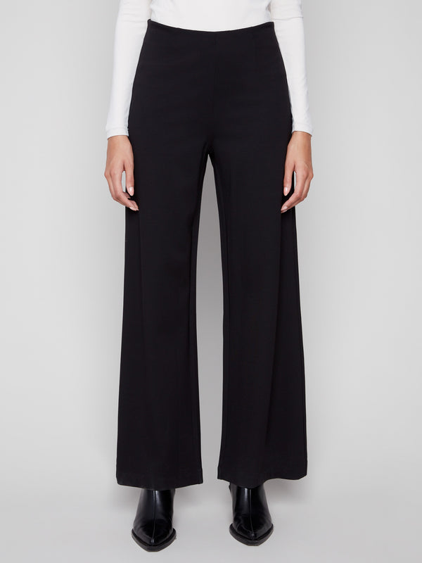 These long black pants feature an elegant design with a smooth finish, perfect for elevating any outfit, by Charlie B.