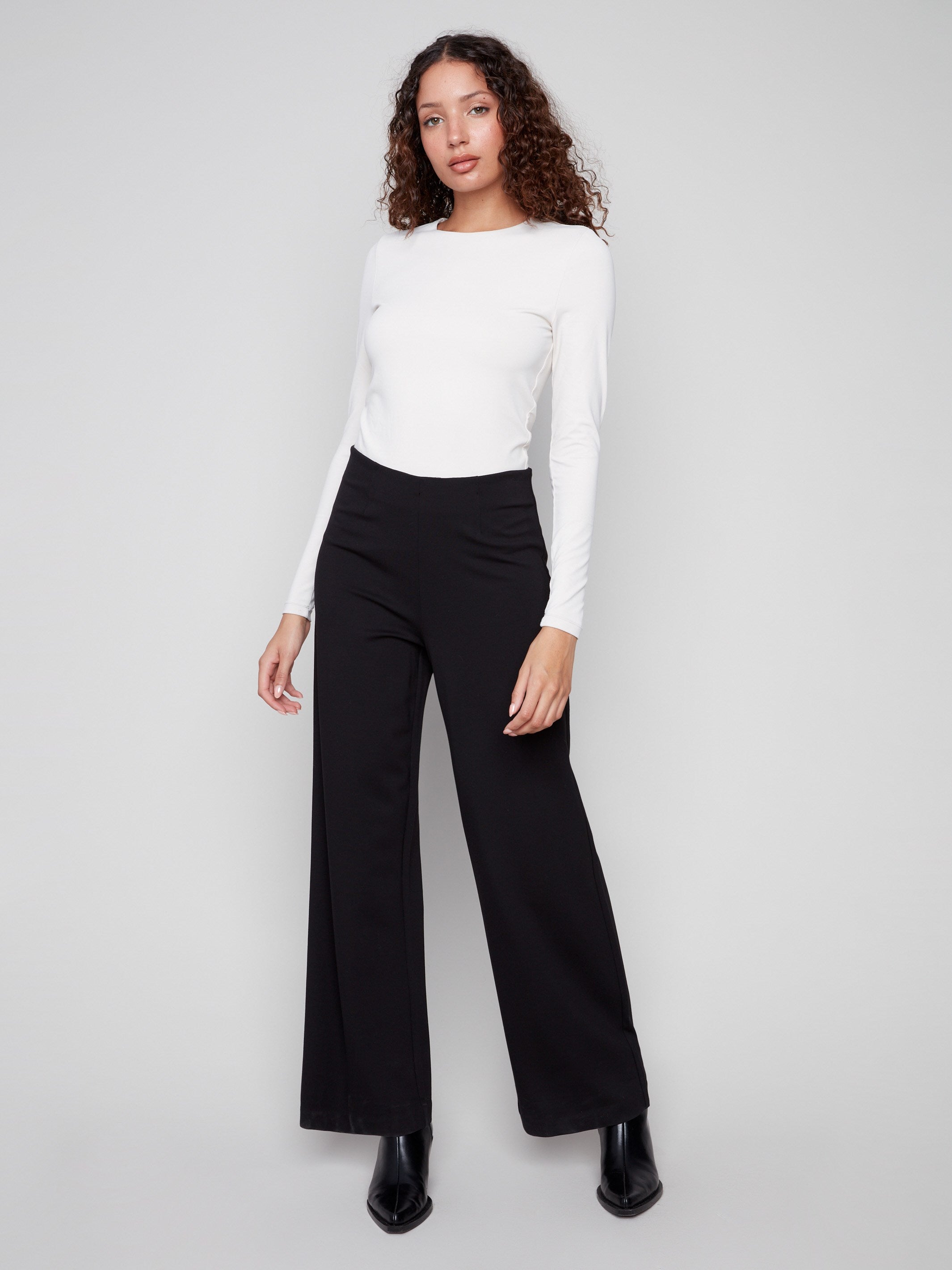 Crafted with an elastic waistband, these black pants ensure ease of movement and a secure fit all day long, by Charlie B.