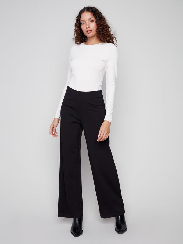 Crafted with an elastic waistband, these black pants ensure ease of movement and a secure fit all day long, by Charlie B.