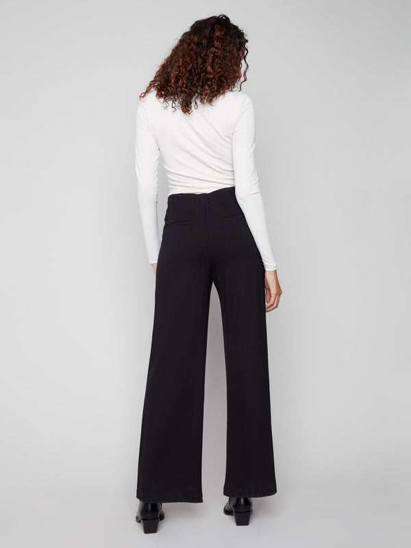 Designed with a mid-rise waist, these black pants provide a classic look that complements various tops effortlessly, by Charlie B.