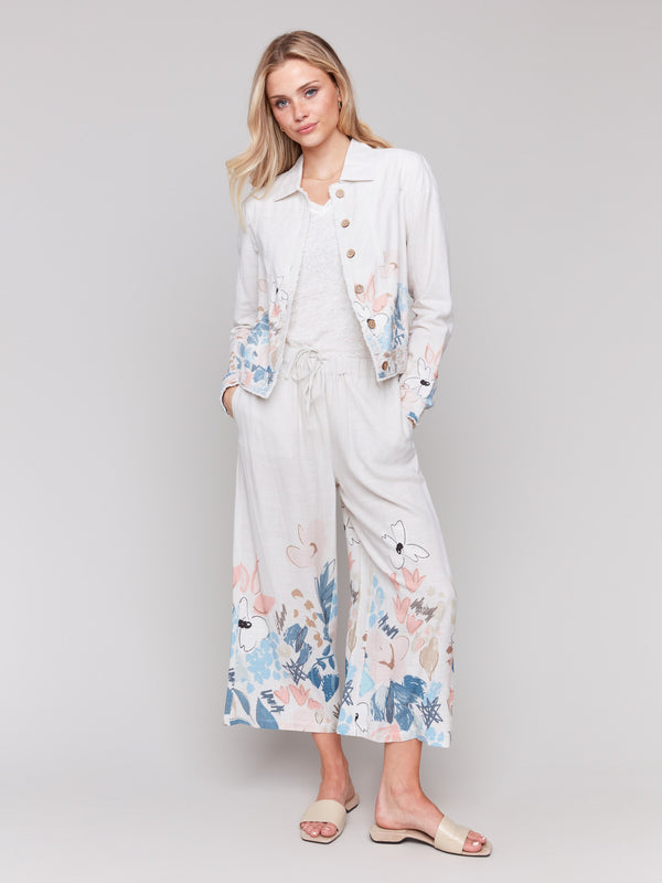 Stylish wide leg cropped pants showcasing a colorful floral motif by Charlie B.