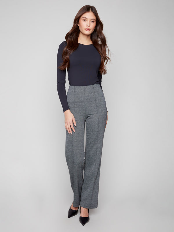 Chic long-length black pants with a flattering silhouette and modern style by Charlie B.