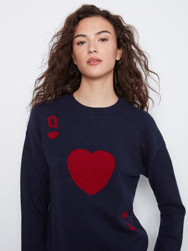 This cozy navy sweater showcases elegant drop shoulders, blending comfort with style seamlessly by Charlie B.
