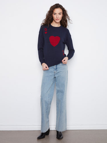 Designed with long sleeves, this navy sweater offers both warmth and chic appeal for cooler days by Charlie B.