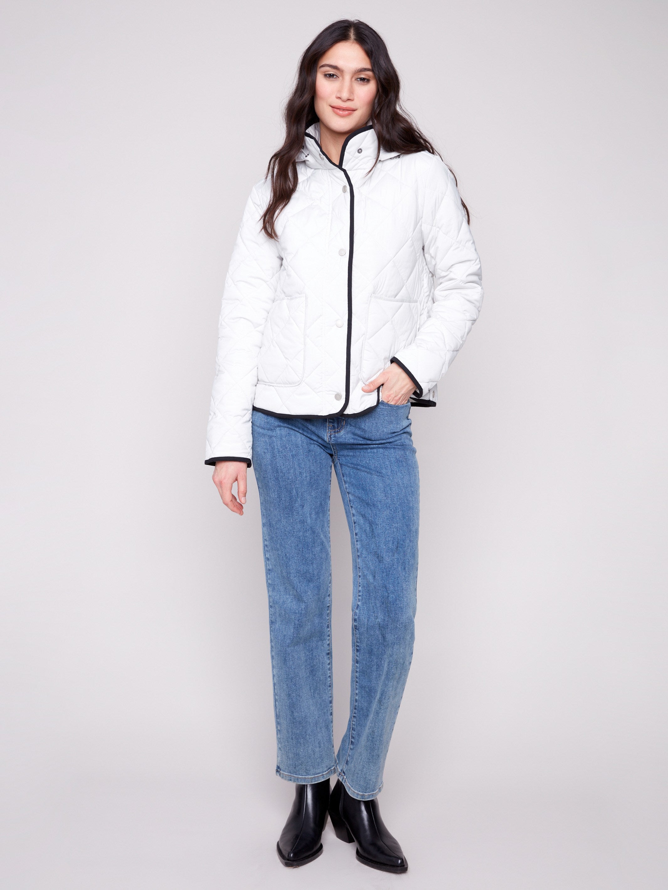 Quilted puffer jacket in almond with a high collar and snap button closures, offering style and warmth by Charlie B.