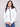 Stylish almond jacket featuring removable hood and front patch pockets for versatile wear by Charlie B.