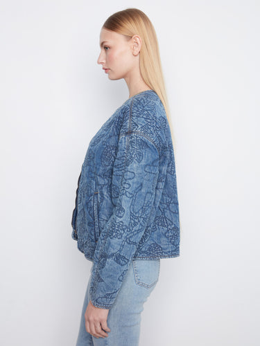 Elegant floral embroidery enhances this denim jacket's appeal, made entirely of 100% Tencel by Charlie B.