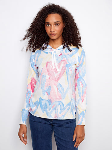 Vibrant hoodie with a unique reverse print design, adding an artistic flair to your wardrobe. Crafted for comfort by Charlie B.