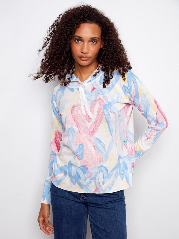 Elevate your style effortlessly with this eye-catching hoodie featuring a playful pattern in soft hues. Created by Charlie B.