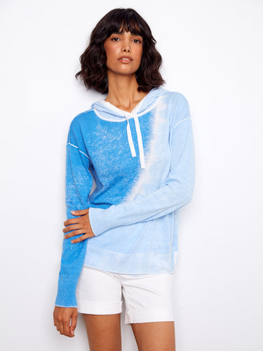 This chic hoodie features an eye-catching reverse print, adding flair to any outfit. Perfect blend of style and comfort by Charlie B.