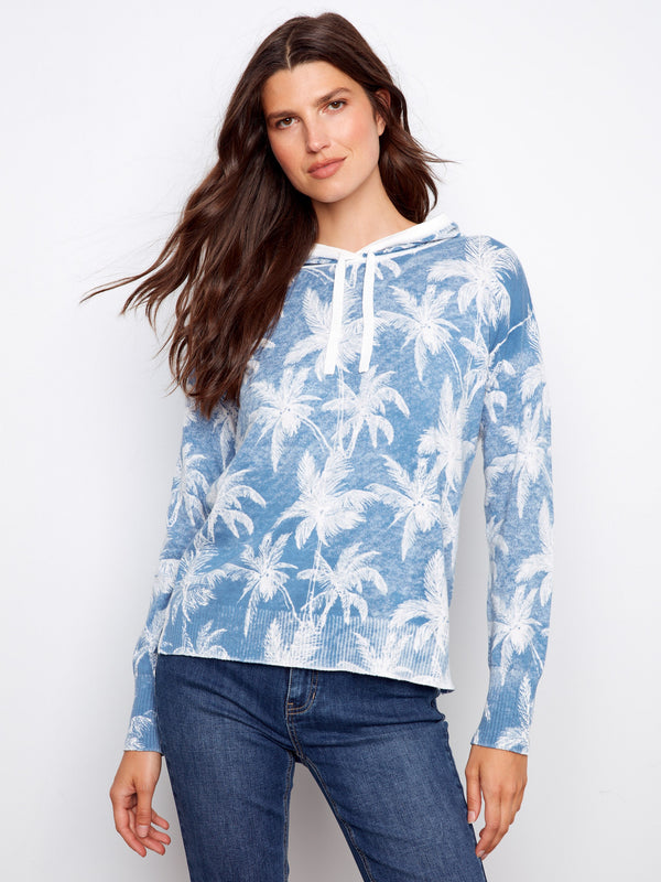 Blue hoodie featuring a unique reverse print design, perfect for casual outings. Made with the softest 100% cotton. by Charlie B.