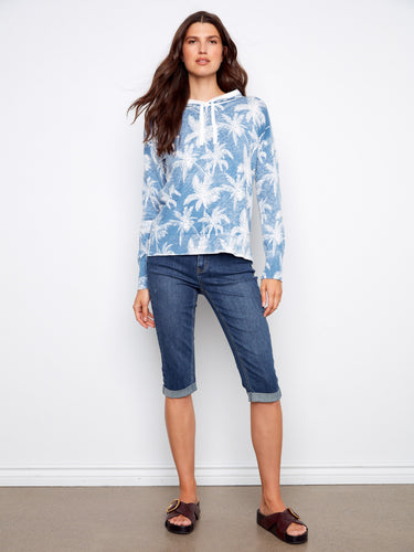 Experience comfort and style with this 100% cotton hoodie, showcasing a trendy reverse print design. Ideal for any casual occasion. by Charlie B.