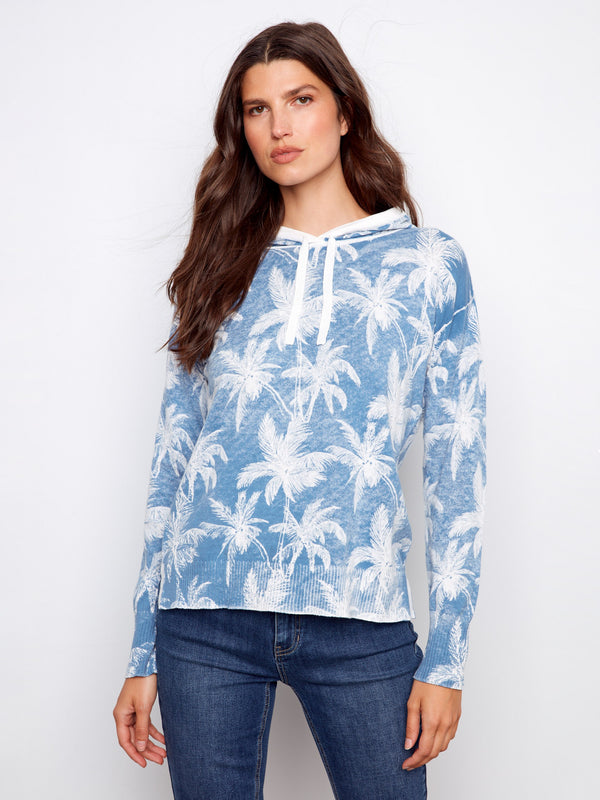 Stay stylish in this blue hoodie crafted from premium 100% cotton, featuring an eye-catching reverse print design. Perfect for layering. by Charlie B.