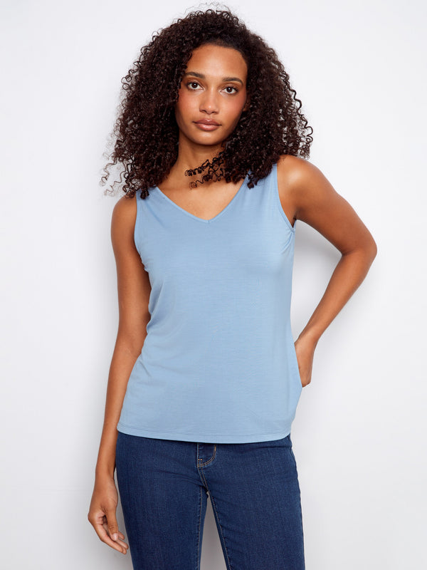Blue tank top with V-neck, showcasing a relaxed fit perfect for casual outings or layering. By Charlie B.