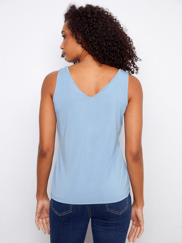 Reversible light blue tank top featuring both scoop neck and V-neck options for diverse styling choices. By Charlie B.