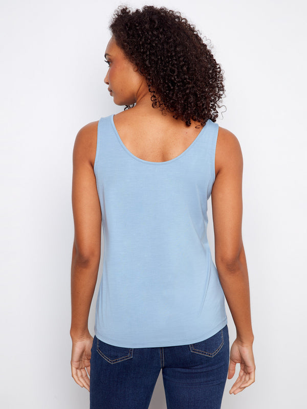 Chic light blue tank in soft fabric, designed with a relaxed fit to enhance everyday wearability. By Charlie B.