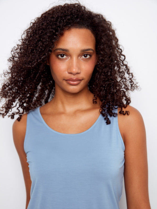 Stylish light blue sleeveless top showcasing the reversible feature, perfect for varied looks. Scoop neckline included by Charlie B.