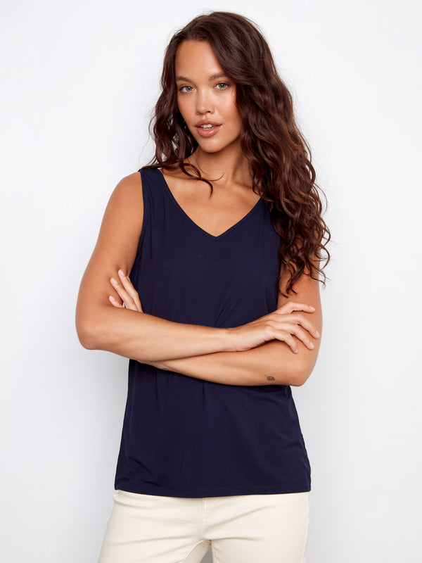 Chic navy top featuring a V-neck design, adding sophistication and versatility by Charlie B.