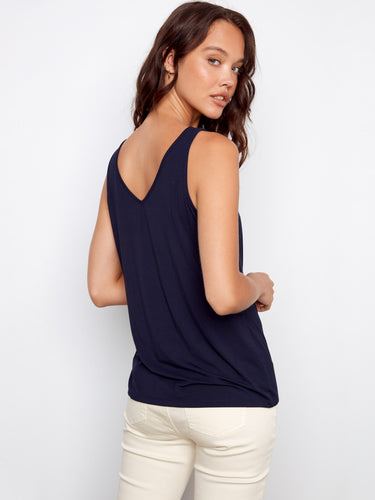 Versatile navy sleeveless shirt highlighting reversible design and soft fabric by Charlie B.