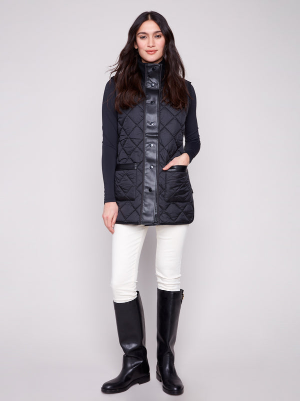 Black quilted vest showcasing a reversible design and practical button front closure by Charlie B.