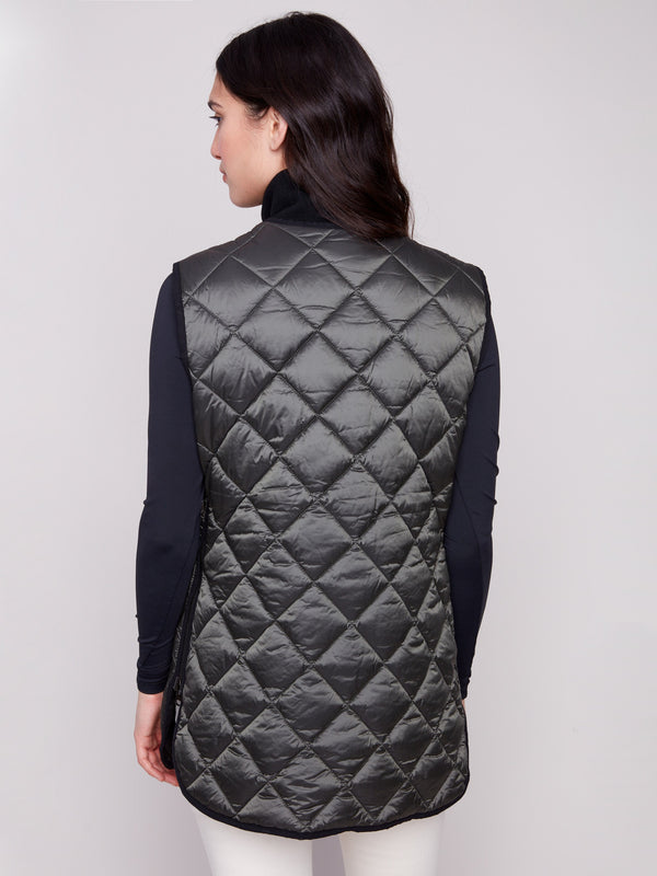 Quilted spruce vest emphasizing button front closure, perfect for layering in various outfits by Charlie B.