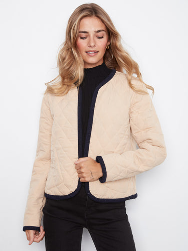 Reversible quilted jacket offering versatile style options, ideal for any season. Crafted by Charlie B.