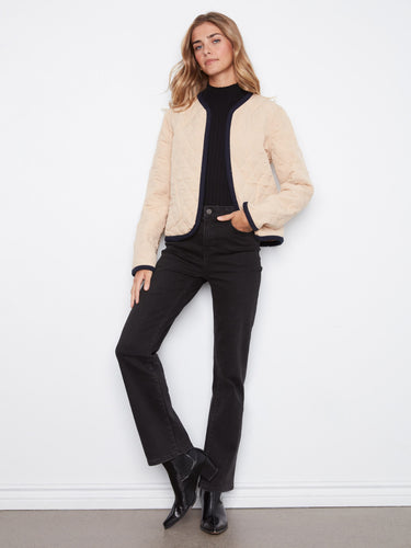 This chic reversible design adds a modern touch to your wardrobe essentials with its unique features. By Charlie B.