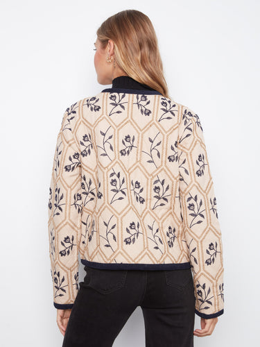 Edge binding detail enhances the sophisticated appeal of this versatile outerwear option from Charlie B.