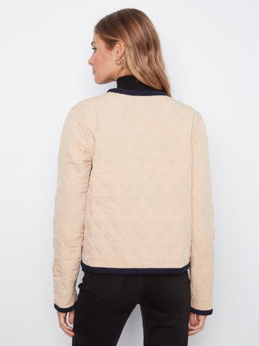 Patch pockets add practicality to this fashionable piece, blending utility and elegance effortlessly. By Charlie B.