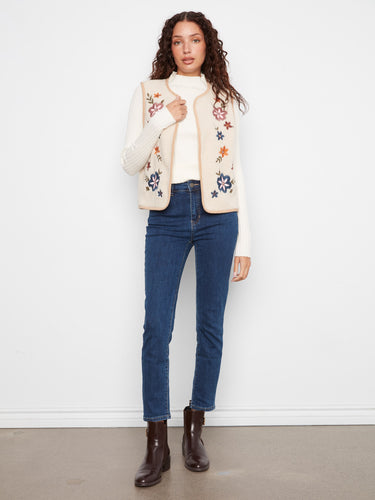 Reversible sleeveless vest with elegant floral embroidery on the sherpa side for added style by Charlie B.