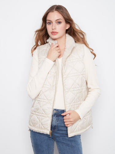 Quilted reversible vest featuring welt pockets, combining functionality with elegance by Charlie B.