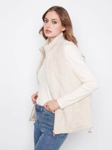 Nylon side displays a sleek quilted design, perfect for modern styling in this versatile vest by Charlie B.