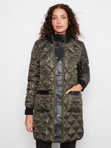 Quilted puffer jacket showcasing reversible design with practical side zippers by Charlie B.