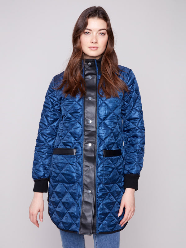 Navy quilted jacket with two front patch pockets and rib-knit cuffs, combining functionality and style by Charlie B.