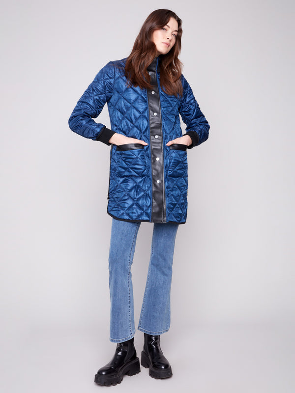 Chic reversible design in navy with snap button closure, offering both warmth and fashion-forward appeal by Charlie B.