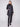 Black quilted puffer jacket with rib knit detailing and two front patch pockets, perfect for a stylish look by Charlie B.