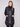 Stylish black puffer coat with two front patch pockets and rib-knit cuffs, offering both functionality and fashion by Charlie B.