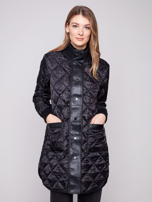 Stylish black puffer coat with two front patch pockets and rib-knit cuffs, offering both functionality and fashion by Charlie B.