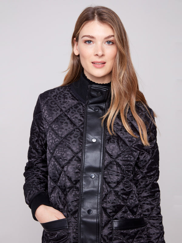 Sophisticated reversible design in a quilted pattern, complete with side zipper details for modern flair by Charlie B.