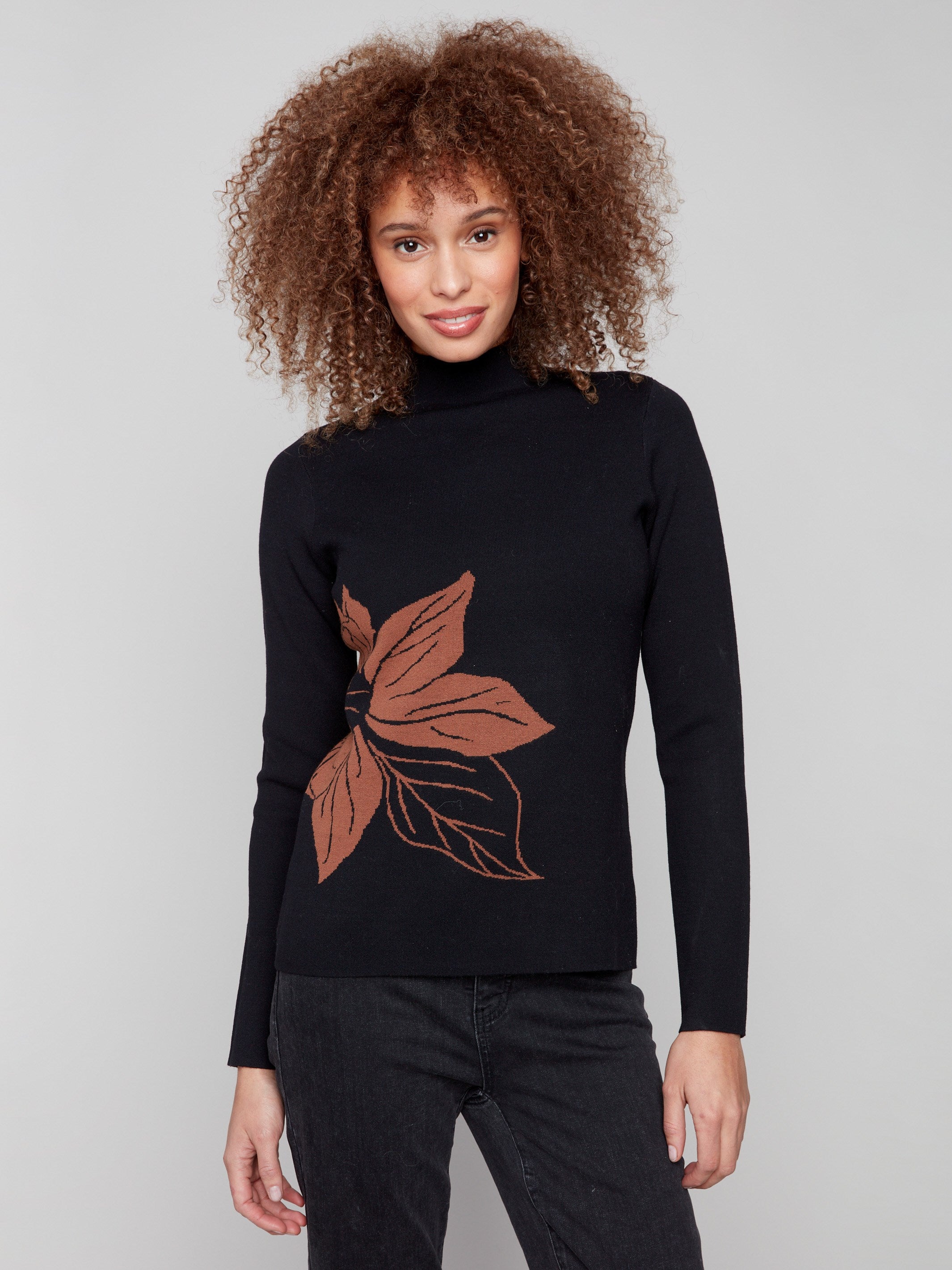 Slim fit sweater with a striking leaf design, perfect for versatile styling by Charlie B.