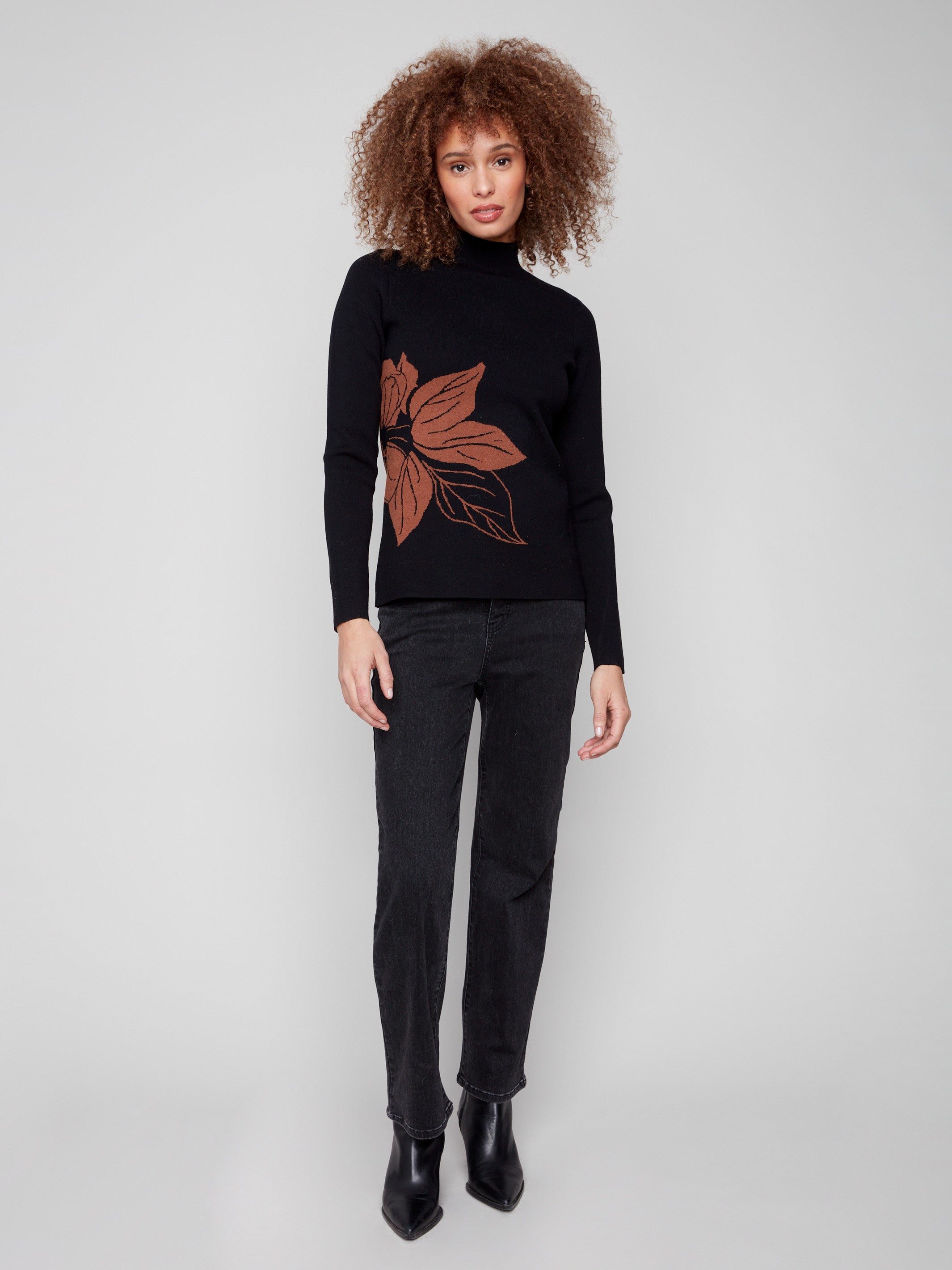Long sleeve black sweater featuring an intricate leaf design for chic layering by Charlie B.