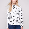 Slim fit sweater with heart pattern, showcasing a playful mock neck design by Charlie B.