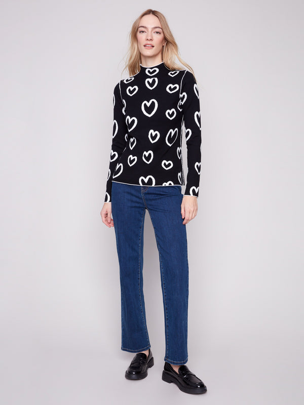 Elegant long-sleeve sweater with a modern heart print on a sleek silhouette by Charlie B.