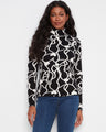 This stylish top features a mock neck, providing a chic and cozy look for any occasion. Crafted with elegance by Charlie B.
