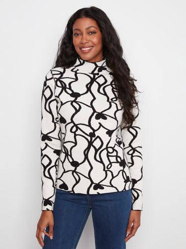 Embrace versatility with this reversible design, offering two looks in one. Perfect for dynamic styling by Charlie B.