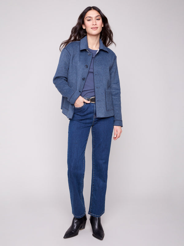 This versatile plaid jacket offers a button front closure, adding a touch of elegance by Charlie B.